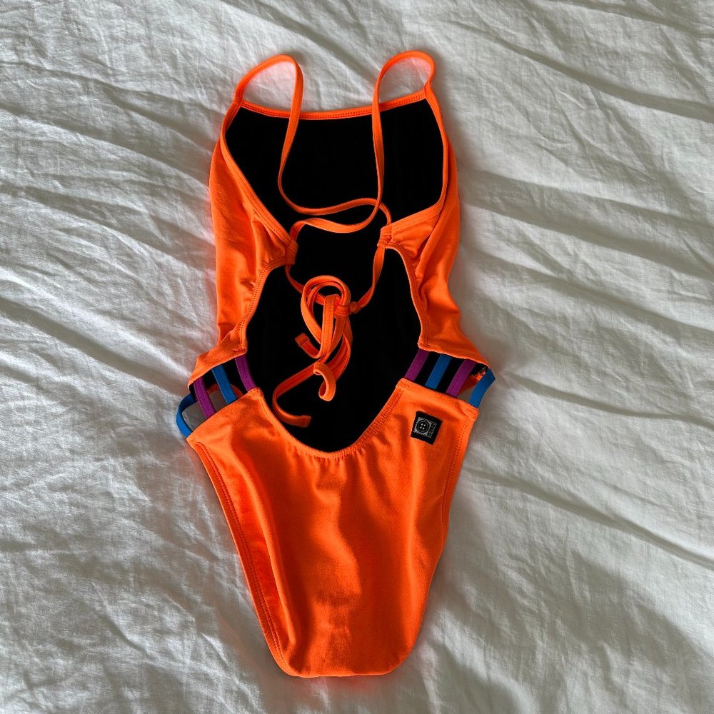 Jolyn Gavin Orange Contrast Onesie